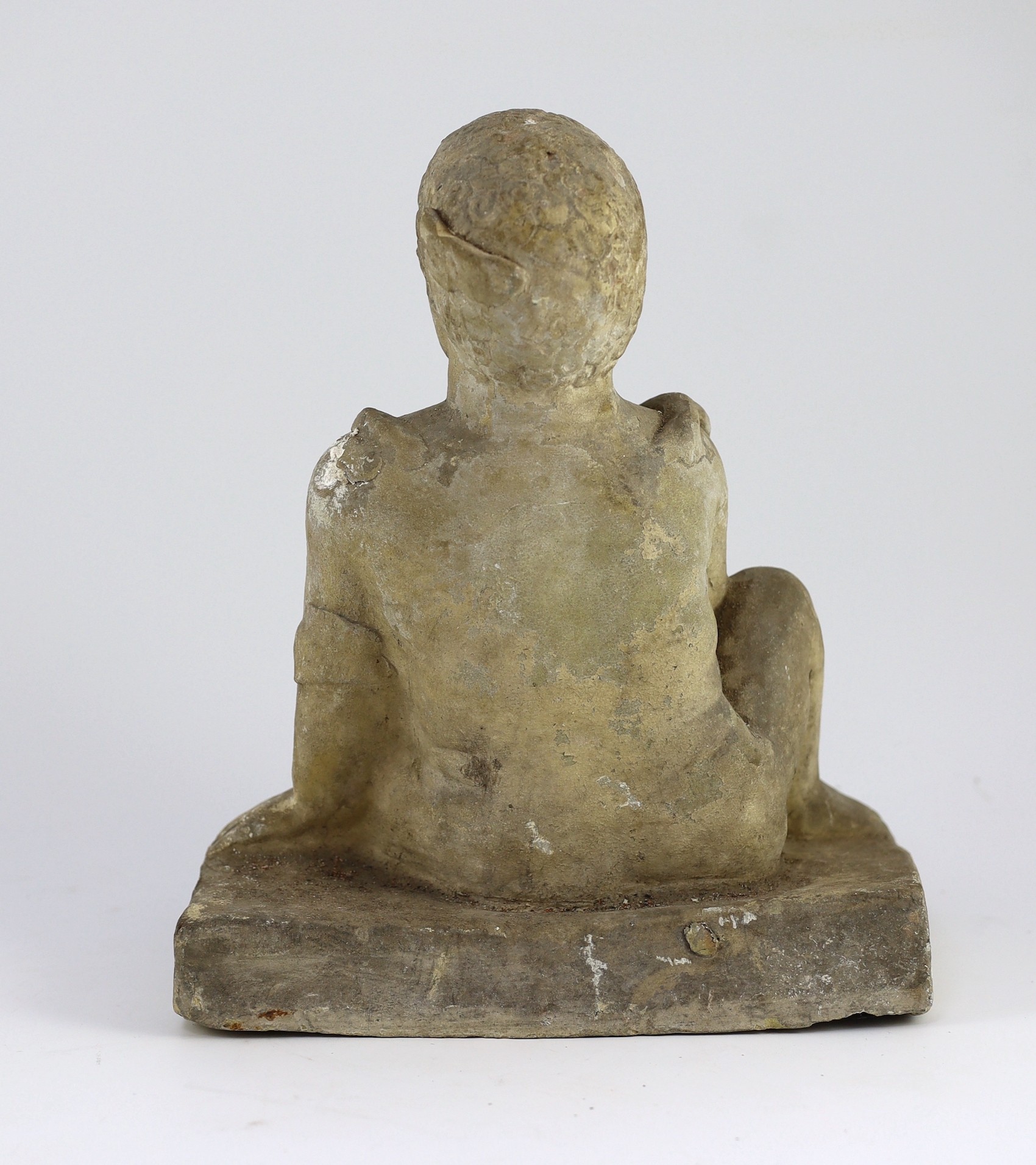 A Cypriot terracotta seated figure of a temple boy, Cypro-Classical II, c.4th century B.C., 29cm high 24cm wide